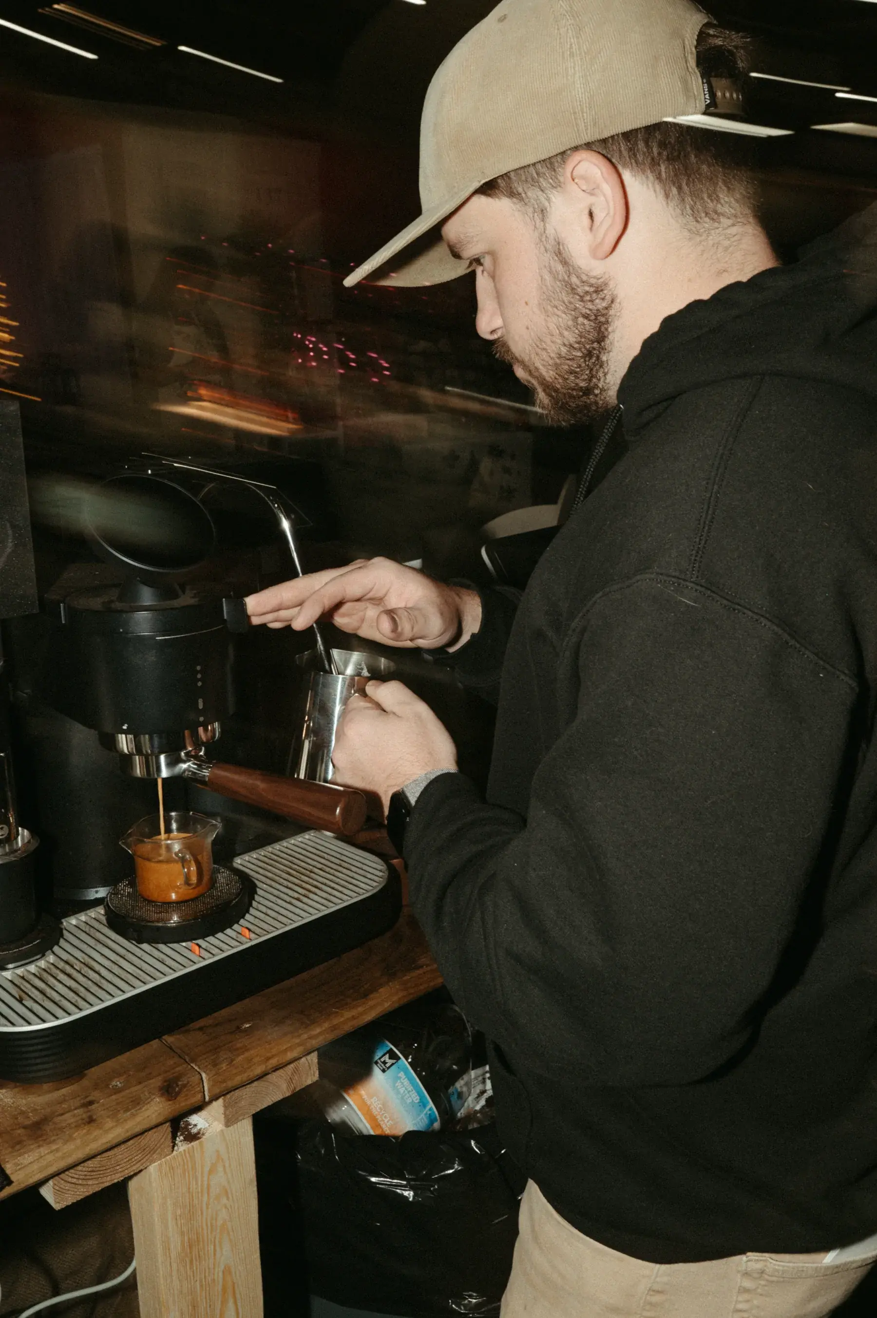 A Cuivre barista making espresso at Santa's Workshop